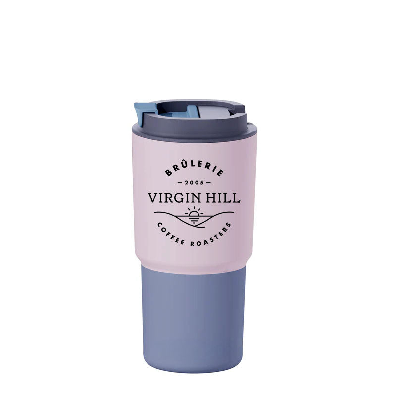 A pastel pink travel mug with a secure lid, featuring the text 'VIRGIN HILL' and branding details.