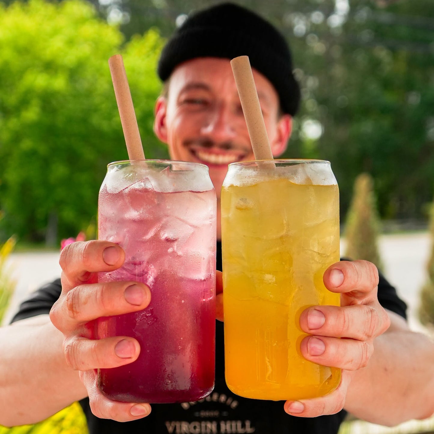 Someone holding 2 recharger drinks.