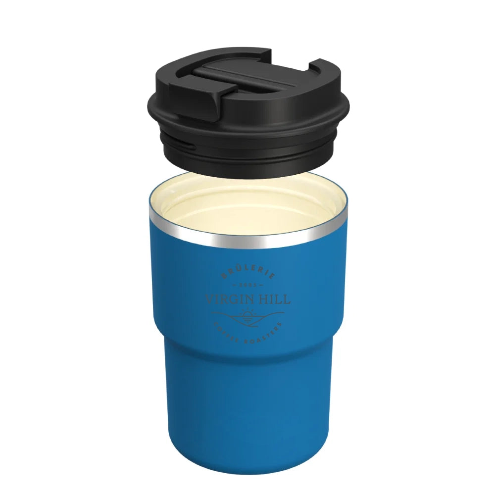 A blue insulated travel tumbler with a black lid, shown with the lid removed and floating above the cup. The cup has a silver metallic rim and a printed logo reading 'Virgin Hill Coffee Roastery' on the front.