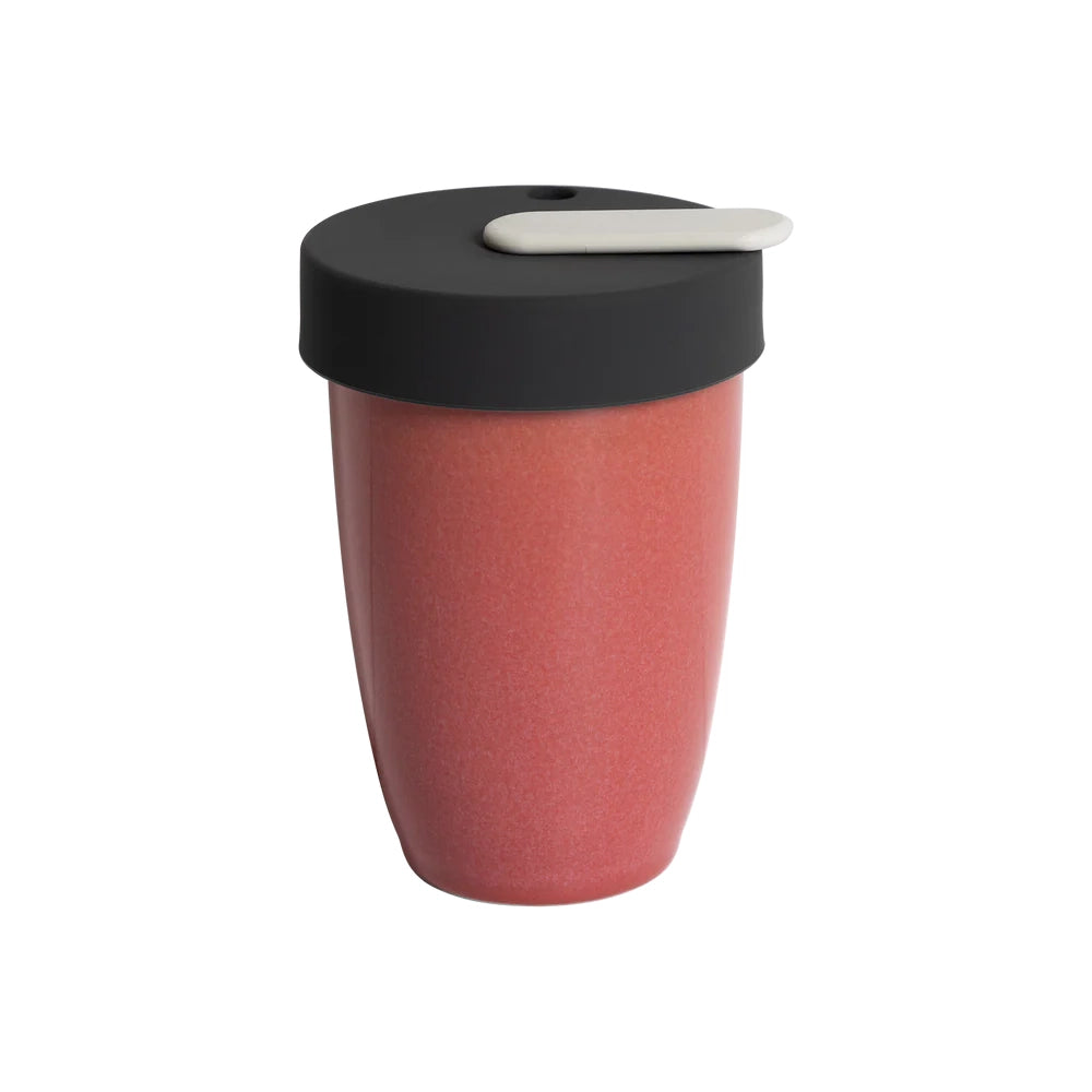 Red travel mug with a black lid on a white background