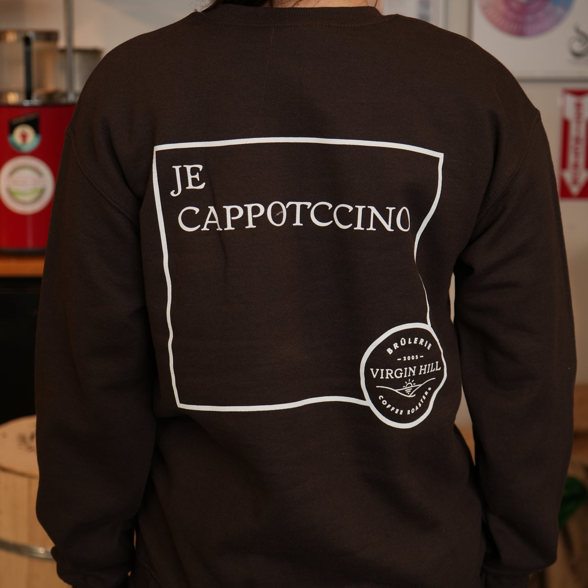 Black sweatshirt with 'JE CAPPOTCCINO' text and 'Virgin Hill Coffee' logo on the back.
