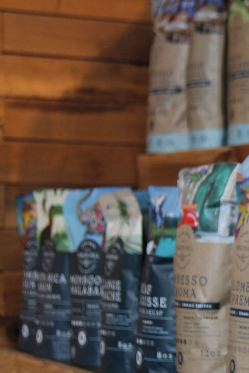 Coffee bags on a wooden shelf