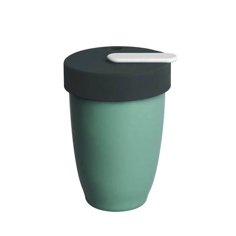 Green travel mug with a black lid on a white background